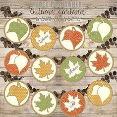 an autumn garland with leaves and acorns is shown on a wooden surface, surrounded by pine cones