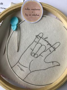 a close up of a embroidery on a hoop