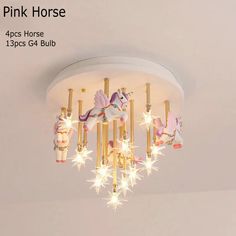 the pink horse chandelier has four lights and is hanging from it's ceiling