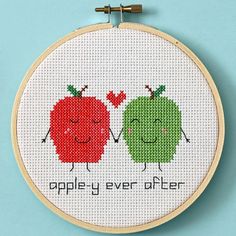 two apples cross stitched together with the words apple y'ever after