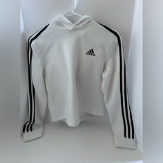 For Sale Is A White Crop Adidas Sweatshirt With A Hood. Never Worn Brand New Condition White Stretch Hooded Top, White Stretch Sweatshirt With Letter Print, White Hooded Sports Top, White Hooded Top For Sports, White Tops With Ribbed Cuffs For Sports Season, White Stretch Hoodie With Ribbed Cuffs, White Winter Sweatshirt With Three Stripes Branding, Winter White Sweatshirt With Three Stripes Branding, White Long Sleeve Sweatshirt With Three Stripes