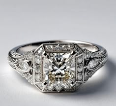 an antique style diamond ring with filigree accents