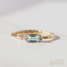 18 carat gold trilogy birthstone ring with an aquamarine centre stone flanked by two white diamonds on a textured band. December Stone Rings, Aquamarine Ring Simple, Gold Aquamarine Ring, Vintage Aquamarine Ring, Aquamarine Birthstone Ring, Diamond Birthstone Ring, Aquamarine Ring Vintage