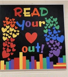 a bulletin board that reads read your heart out with hearts and rainbows on it