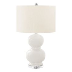 a table lamp with a white shade on it