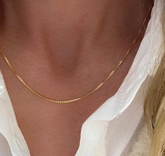 "Gold Box Chain Necklace for her. This dainty chain is an instant classic with rich lustrous colour of real 14k gold. Wear on its own as the perfect finishing touch - it also looks fantastic layered with other necklaces. Available lengths: 16\" 18\" 20\" - 1mm wide - 14k Gold over 925 sterling silver - finished with a strong spring ring clasp - hallmarked 925 Sterling Made in Italy Some photos are magnified closeups to show chain details. Please measure and select chain length carefully using st Dainty Chain Necklace With Box Chain For Gift, Dainty Box Chain Necklace As A Gift, Dainty Box Chain Necklace For Gift, Elegant Hypoallergenic Snake Chain Necklace, Dainty Box Chain Necklace, Classic Hypoallergenic Chain Necklace As Gift, Hypoallergenic Gold Sterling Silver Chain Necklace, Simple Box Chain Jewelry For Gift, Simple Box Chain Jewelry Gift