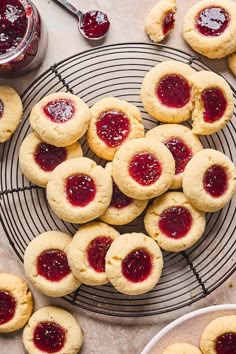 cookies with jam are on a cooling rack