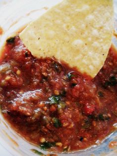 a bowl filled with salsa and tortilla chips