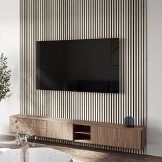 a living room with a large flat screen tv mounted to the side of a wall