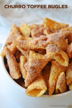 churro toffe bugles in a white bowl with cinnamon sugar on the top