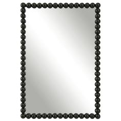 a black beaded mirror on a white background