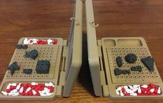 two waffle irons with red, white and blue food inside them on a wooden table