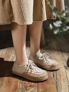 The perfect blend of style and comfort. These shoes are designed to elevate your casual looks with their unique and eye-catching design. Crafted with premium quality linen, our Embroidered Linen Sneakers are designed to be soft, breathable and comfortable. The intricate floral embroidery on the upper adds a touch of elegance and sophistication to the classic design, making them a stylish addition to any wardrobe. 0.98" heel Lace-up closure Canvas linen upper Textile lining Natural straw mat brea Spring Streetwear Sneakers With Flat Bottom, Textile Sneakers With Flat Heel And Laces, Trendy Beige Low-top Canvas Shoes, Breathable Canvas Sneakers For Spring, Comfortable Beige Canvas Shoes With Rubber Sole, Trendy Beige Flat Sneakers, Comfortable Beige Lace-up Sneakers, Trendy Round Toe Sneakers For Leisure, Low-top Summer Lace-up Shoes