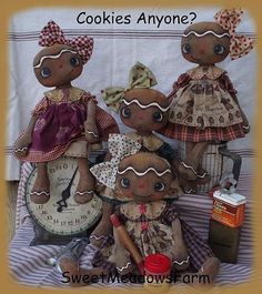 three little dolls are sitting next to each other on a bed with the words cookies anyone?