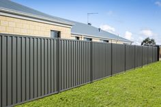 an image of a fence installed in front of a house with the words colorado fence installation perth on it