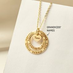 These two rings are stamped with her loved one and a small heart charm at the center to share their love with family members. The heart charm can be engraved with however you call your grandma: nana, mimi, abuela, omi, gigi - just whichever dear to you! A perfect gift for Grandma on any occasion. ► GRANDMA NECKLACE WITH KIDS NAMES * WORD LIMIT: Small ring: 4-5 words / Big ring: 6 words. Date is counted as 2 words. *  Small ring measures approx. 3/4" (20mm). Big ring measures approx. 1" (26mm). H Name Necklace For Anniversary Gift, Custom Name Charm Necklace For Mother's Day, Grandma Necklace Not On The High Street, Grandma Name Necklace, Grandmother Necklace Birthstones, Grandma Jewelry, Customised Birthday Gifts, Nana Christmas Gifts, Necklace With Kids Names