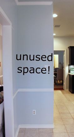 an uninsed space sign is posted on the wall in a kitchen and living room