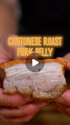 someone holding a piece of meat in their hands with the caption, cantoise roast pork - belly