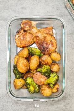 chicken and broccoli in a glass dish on a table with other food items