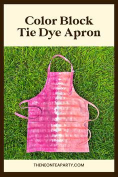 an apron on the grass with text overlay that reads, color block tie dye apron