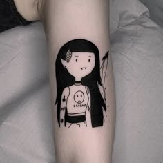 a person with a black and white tattoo on their arm that has an image of a woman holding a baby