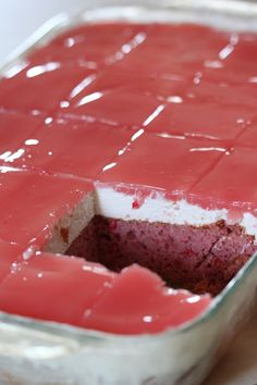 a cake in a pan with red icing