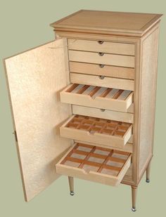 an open cabinet with drawers on each side