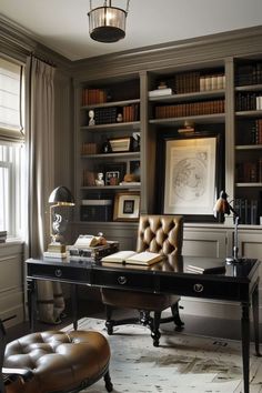 a home office with lots of bookshelves and leather chairs in front of the desk