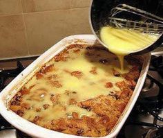 someone is pouring cheese into a casserole dish