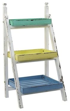 a white ladder with blue and yellow steps on the bottom shelf, against a white background