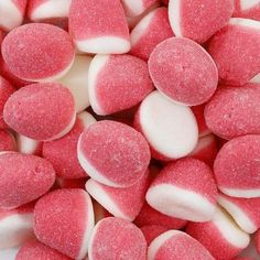 pink and white candy hearts are scattered together