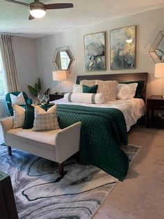 a bedroom with green and white decor in it