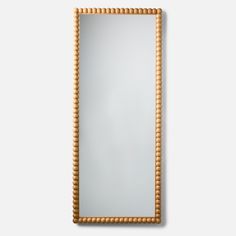 a mirror that is made out of wood and has beads on the edge of it