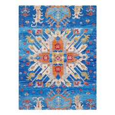 a blue and orange rug with an ornate design on the bottom, in front of a white background