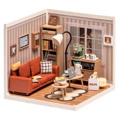 a doll house living room with furniture and bookshelf