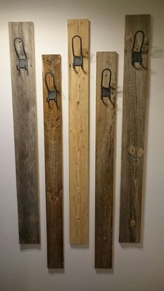 three wooden skis are hanging on the wall