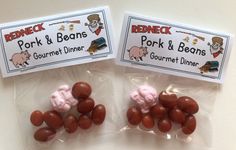 two bags of pink and brown candies sitting next to each other on a table