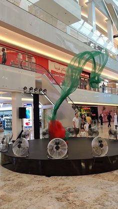 a sculpture in the middle of a shopping mall