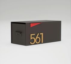 a black mailbox with the number 561 on it