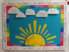 a bulletin board with the words, the sun will come out and clouds above it