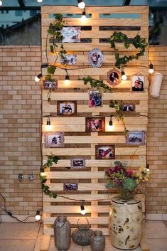 a wooden pallet with pictures and lights on it