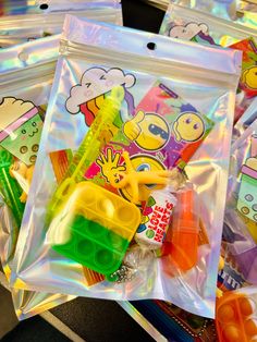 some plastic bags filled with different types of toys