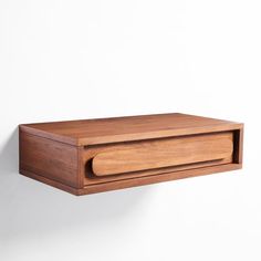 a wooden shelf mounted on the wall