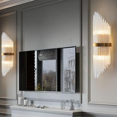 a bathroom vanity with two mirrors and lights on the wall above it, along with a fireplace