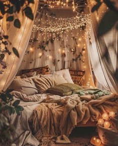 a bed with lights hanging from the ceiling and blankets on it's headboard