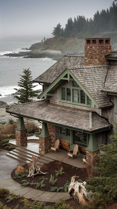 the house is next to the ocean and trees