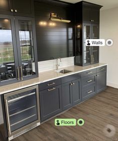 an empty kitchen with stainless steel appliances and wood flooring is shown in this image