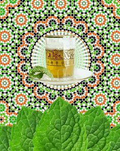 a cup of tea sits on top of a leafy green plant with an orange and black pattern in the background