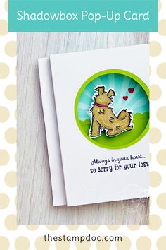 a card with the words shadowbox pop - up card on it and a dog