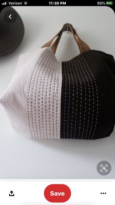 a black and white purse sitting on top of a table